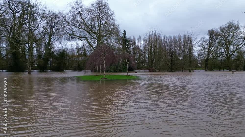 Forward drone movement over the flood watered Le Parc des Ondines public park, Changé in Mayenne, France.