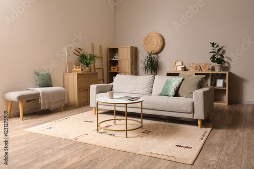 Interior of modern living room with grey sofa and coffee table