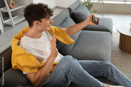 Young man video calling on ...
