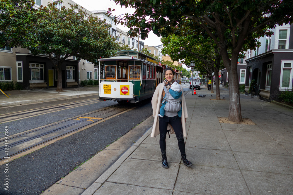 Mother and her child in front of cable car of San Fransicso