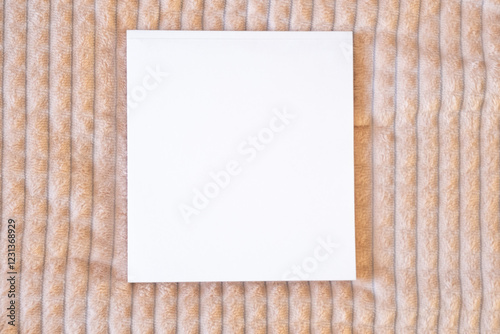 White sketchbook on a soft blanket. Mockup template.