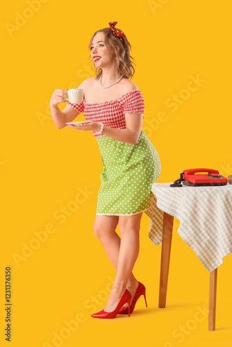 Young pin-up housewife with...