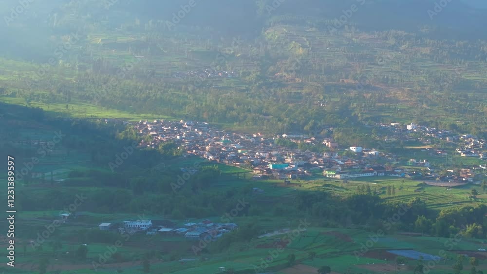 Aerial view of Nepal Van Java colorful village covered in mist, Indonesia Aerial view of Nepal Van Java colorful village covered in mist, Indonesia