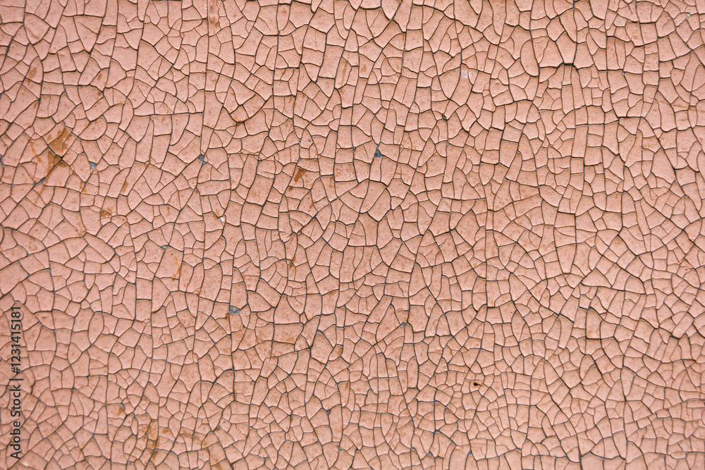 Close-up. A missing patch of stucco and paint on the wall exposing the cement brown coat, rest is cracked and peeling. Badly fixed building facade wall covered with cracks in stucco and paint Close-up. A missing patch of stucco and paint on the wall exposing the cement brown coat, rest is cracked and peeling. Badly fixed building facade wall covered with cracks in stucco and paint