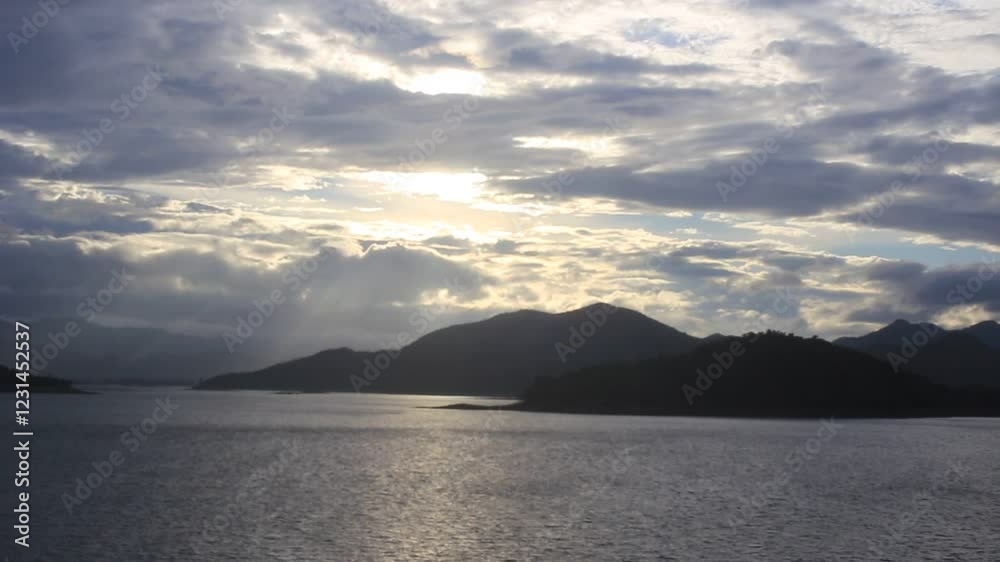 Beautiful blooming flowers by the lake at Kaeng Krachan, Thailand. A scenic nature view with a peaceful atmosphere.
