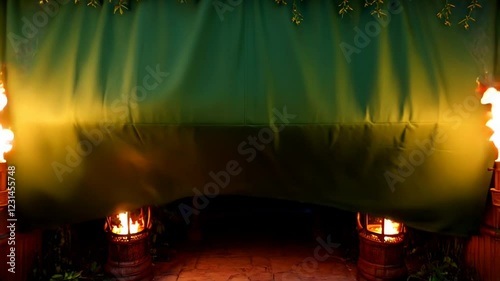 Tropical Tiki Torch Backdrop:  A Nighttime Scene with Flaming Torches and Carved Statues