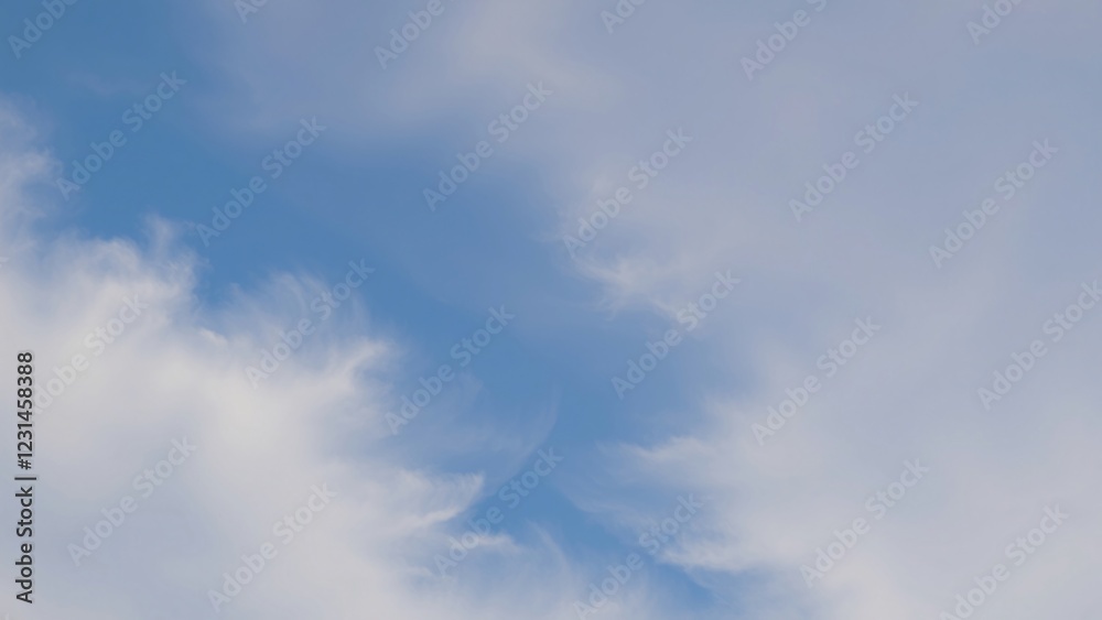 Serene Blue Sky with Wispy White Clouds - Peaceful Nature Background Serene Blue Sky with Wispy White Clouds - Peaceful Nature Background