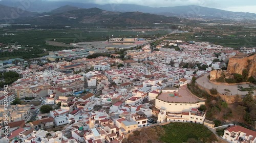 Salobrena village from above with Sierra Nevada in the back. High quality 4k aerial view drone footage