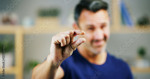 Man, hands and sign for small size, measurement or emoji in creative startup. Fingers, pinch and person with tiny gesture for minimalist design, scale or show little symbol for growth in niche market