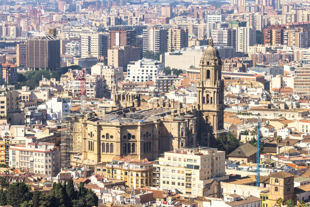 Malaga, seaside city in Andalusia, Spain, Europe. Aerial view of a city with a large cathedral and numerous buildings. Malaga, seaside city in Andalusia, Spain, Europe. Aerial view of a city with a large cathedral and numerous buildings.