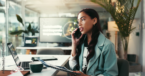 Business woman, talking and laptop with phone call for advice, eco friendly organisation or discussion at office. Female person, environmentalist or consultant on mobile smartphone for green project photo