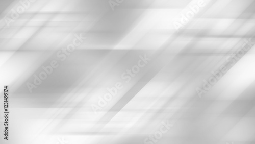 Abstract gray background features diagonal light streaks and shadows..