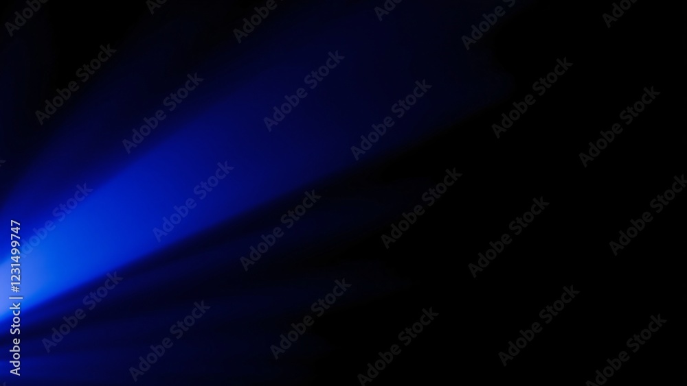 Abstract Blue Light Beam on Black Background - Dramatic Lighting Effect Abstract Blue Light Beam on Black Background - Dramatic Lighting Effect