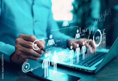 A business professional analyzing human resource management and organizational structure with a futuristic digital interface. Concepts of teamwork, leadership, and employee performance evaluation.