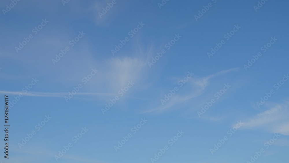 Serene Blue Sky with Wispy Clouds - Peaceful Nature Background Serene Blue Sky with Wispy Clouds - Peaceful Nature Background