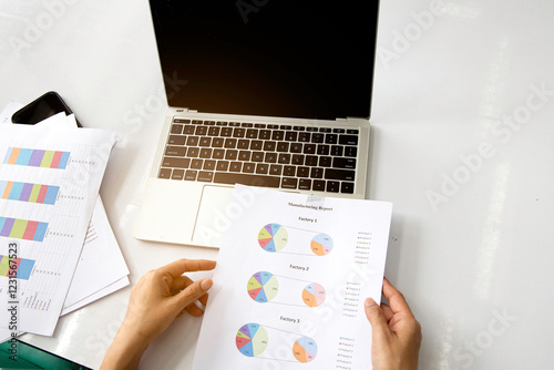 Obraz na płótnie Business woman work at office with laptop and report finance, sales summary document on table. w salonie