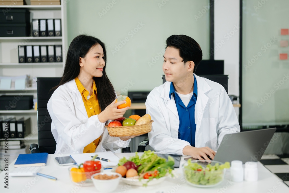 Nutritionists consulting on healthy food choices, meal planning, and wellness concepts Nutritionists consulting on healthy food choices, meal planning, and wellness concepts