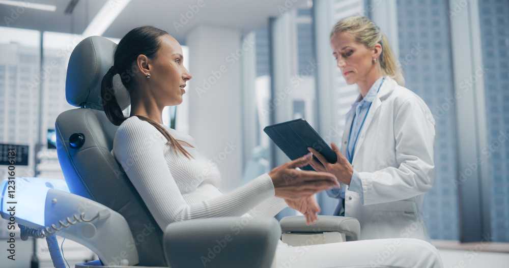 Female Doctor Consults With Female Patient in a Futuristic Medical Laboratory Clinic, Discussing Various Healthcare Solutions. Modern Clinic Features Advanced Technology, High-tech Medical Environment Female Doctor Consults With Female Patient in a Futuristic Medical Laboratory Clinic, Discussing Various Healthcare Solutions. Modern Clinic Features Advanced Technology, High-tech Medical Environment