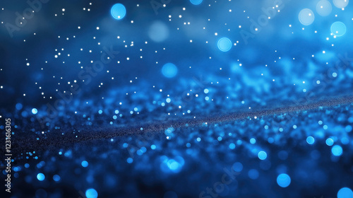 Mesmerizing abstract scene of blue glowing particles resembling snowfall or water droplets under soft light.Sparkling cold winter background with bokeh effect and space for text photo