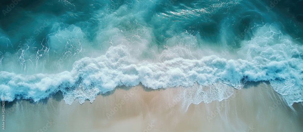 Serene turquoise waves crest softly against a pristine white sandy beach, showcasing the ocean's beauty in a tranquil coastal scene.