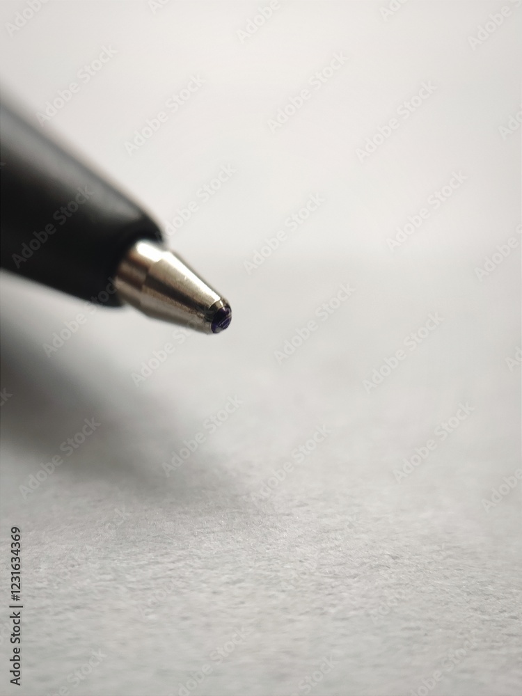 close up of a tip ballpoint ballpen for writing with hand close up of a tip ballpoint ballpen for writing with hand