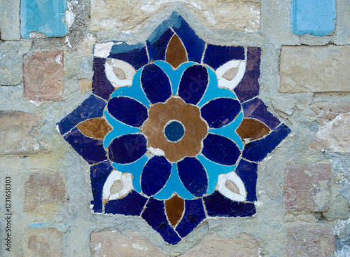 Uzbek ceramic porcelain mosaic with flowers on wall of madrasa in Uzbekistan, Asia