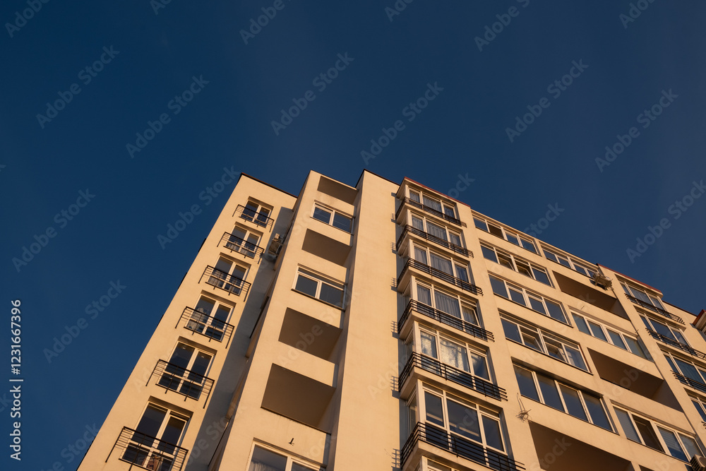 Modern Apartment Building Against Blue Sky Modern Apartment Building Against Blue Sky