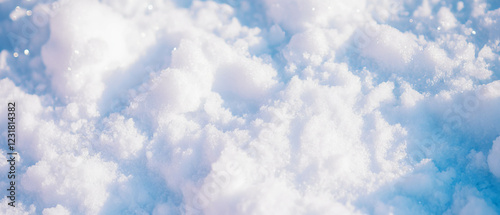 Fresh snow gently blankets a soft surface against a dark winter backdrop