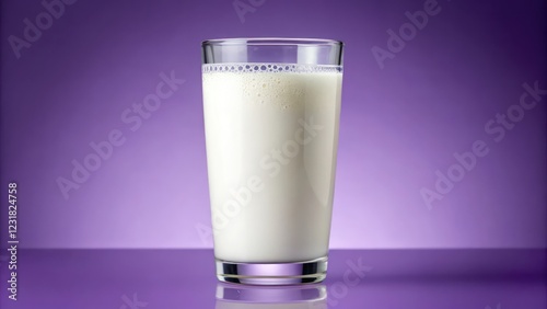 Glass of milk on a purple background