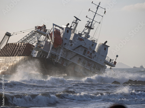 The ship stranded and wrecked. Stormy sea in overcast weather waves crash on a pier near the shore in marina di massa tuscany italy