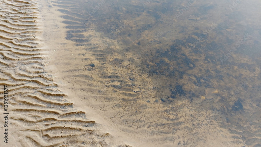 Sand art of a beautiful beach. Floating wave on the sand Sand art of a beautiful beach. Floating wave on the sand