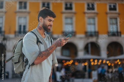 Tourist using smart phone in lisbon, portugal, exploring commerce square photo