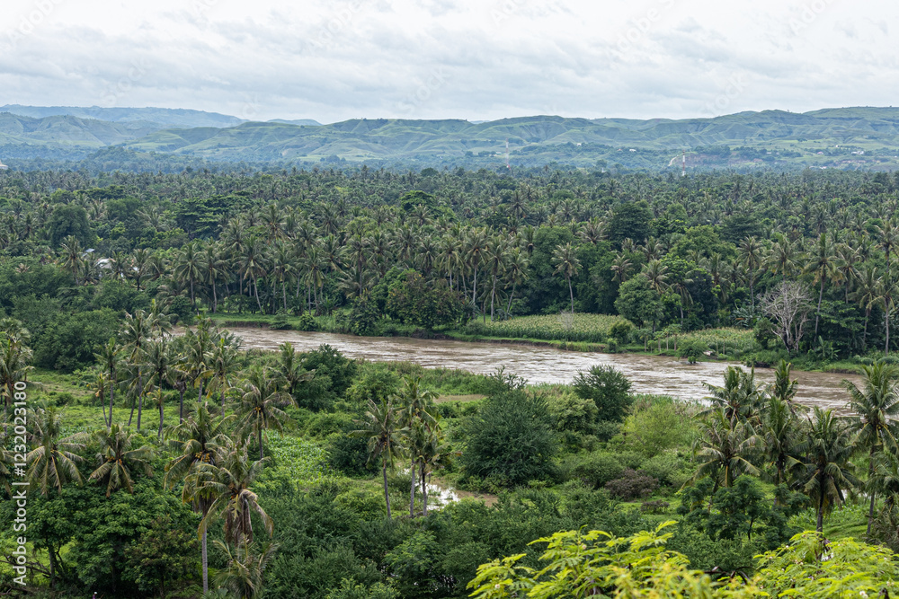 Obraz premium East Sumba, East Nusa Tenggara, Indonesia – 02. 24. 2024 – Heavy rain for two consecutive nights in East Sumba has caused a major flood in the Kambaniru River, with the community on alert 