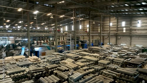 High-Tech Industrial Textile Manufacturing Factory with Machinery and Fabric Rolls 4K Aerial Footage