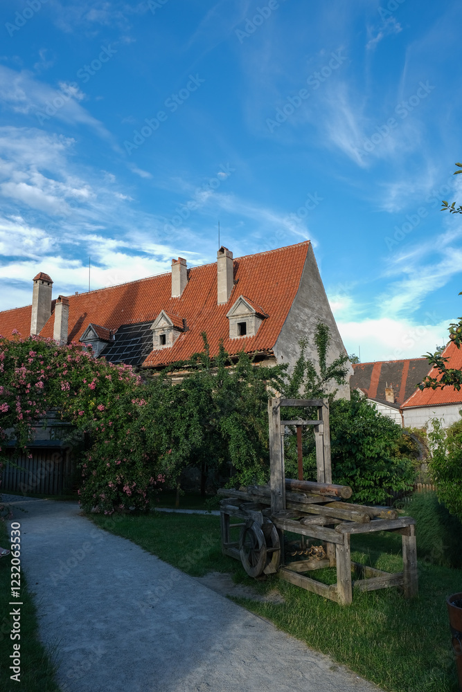 Rustic House with Red Roof and Wooden Cart Rustic House with Red Roof and Wooden Cart