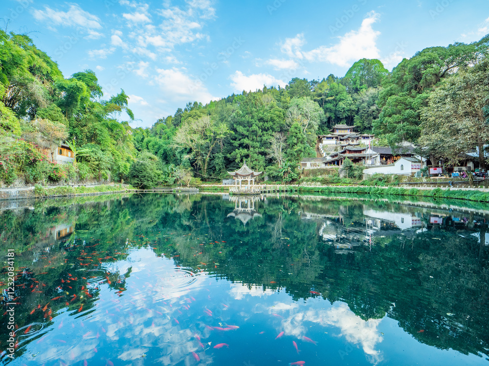Fototapeta premium Reflections of ancient buildings in the mountains of Heshun Ancient Town, Tengchong, Yunnan