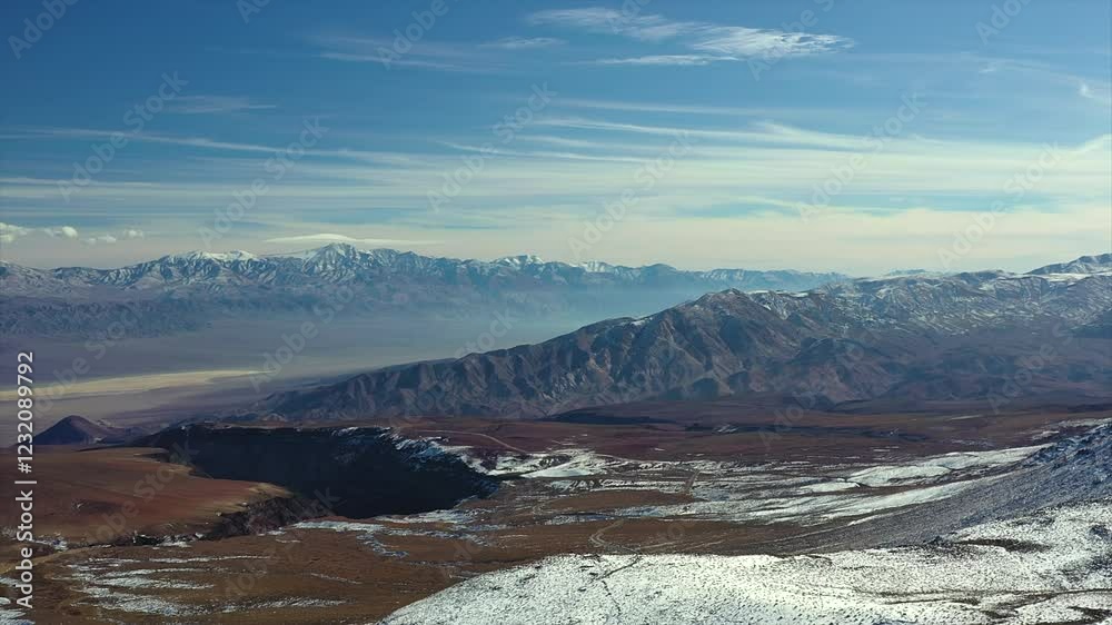 A View Of Death Valley National Park During Winter With Soft Blue Color Sky At Sunrise. Aerial Pullback Shot A View Of Death Valley National Park During Winter With Soft Blue Color Sky At Sunrise. Aerial Pullback Shot
