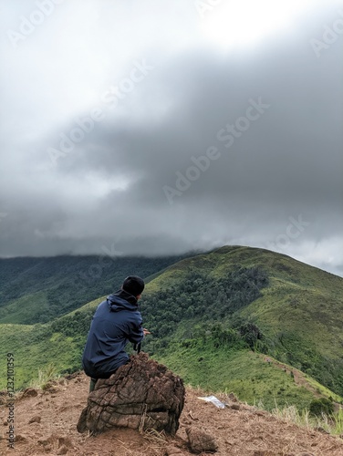 person on the top of the mountain