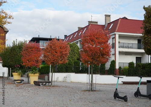 Rewal, Poland, Wielorybow square in Autumn, no people, two electronic scooters for rent photo