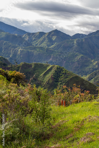 Tierradentro, Inza, Cauca, Colombia.  Beautiful landscape of the Andes Mountains. Valley, lush vegetation, peak, crops. Picture taken from the Alto del Aguacate. photo