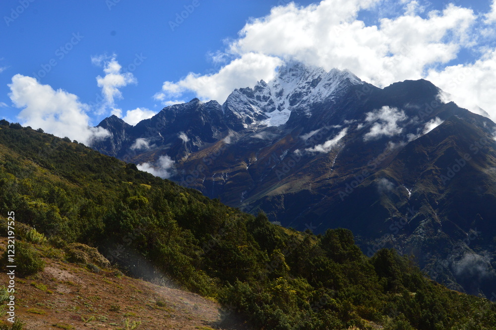 Hiking in the stunning Khumbu Valley surrounded by glaciars and snowy peaks in the Himalayan Everest Base Camp Trek Hiking in the stunning Khumbu Valley surrounded by glaciars and snowy peaks in the Himalayan Everest Base Camp Trek