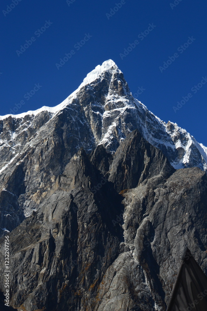 The stunning Himalayan Mountain ranges with snowy glaciars and breathtaking views of Mount Everest, Ama Dablam and Lhotse while trekking The stunning Himalayan Mountain ranges with snowy glaciars and breathtaking views of Mount Everest, Ama Dablam and Lhotse while trekking