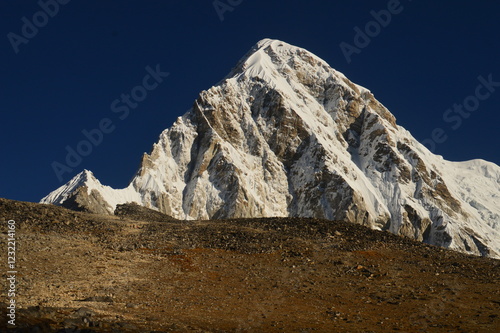 Close up of Mount Everest during sunrise in the Khumbu Valley of the Himalaya mountains in Nepal photo