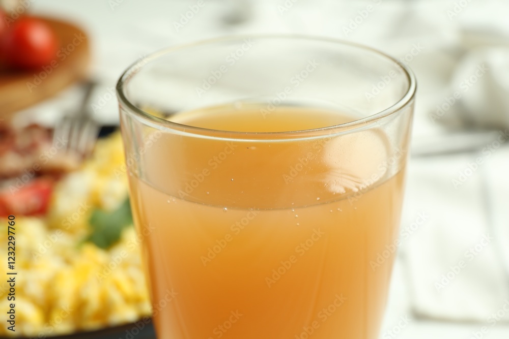 Glass of fresh apple juice and tasty brunch served on table, closeup Glass of fresh apple juice and tasty brunch served on table, closeup