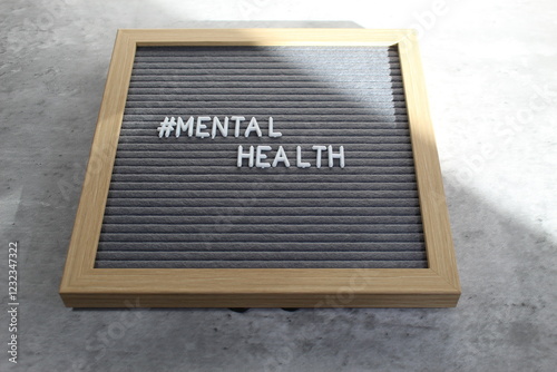 Mental health written out on a letter board in white letters. 