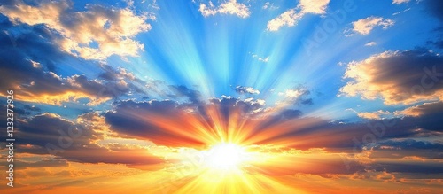 Vibrant sunset with sun rays bursting through clouds.