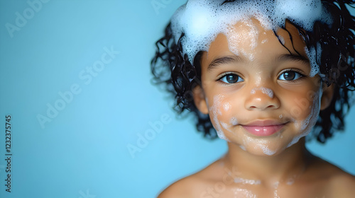 Smiling Child with Soap Sud...
