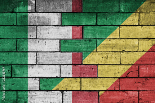 Fototapeta Naklejka Na Ścianę i Meble -  colourful painted big flag of italy and flag of republic of the congo on a massive old brick wall background. concept