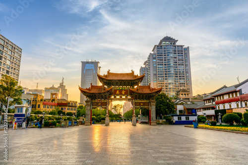 Kunming City China Jinbi square the ancient archway in morning light. photo