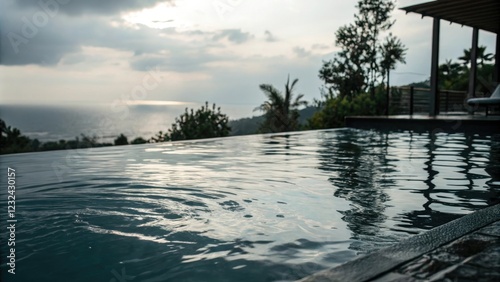 Dark glassy surface of a pool with gentle ripples and subtle water reflections, darkness, rippled surface photo